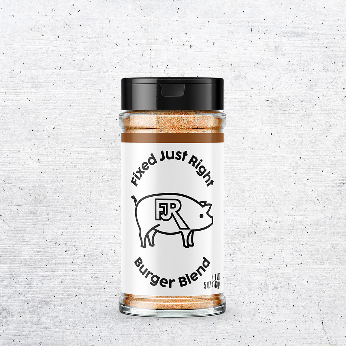 5oz shaker bottle of Fixed Just Right's Burger Blend, featuring the company logo with brown accents.