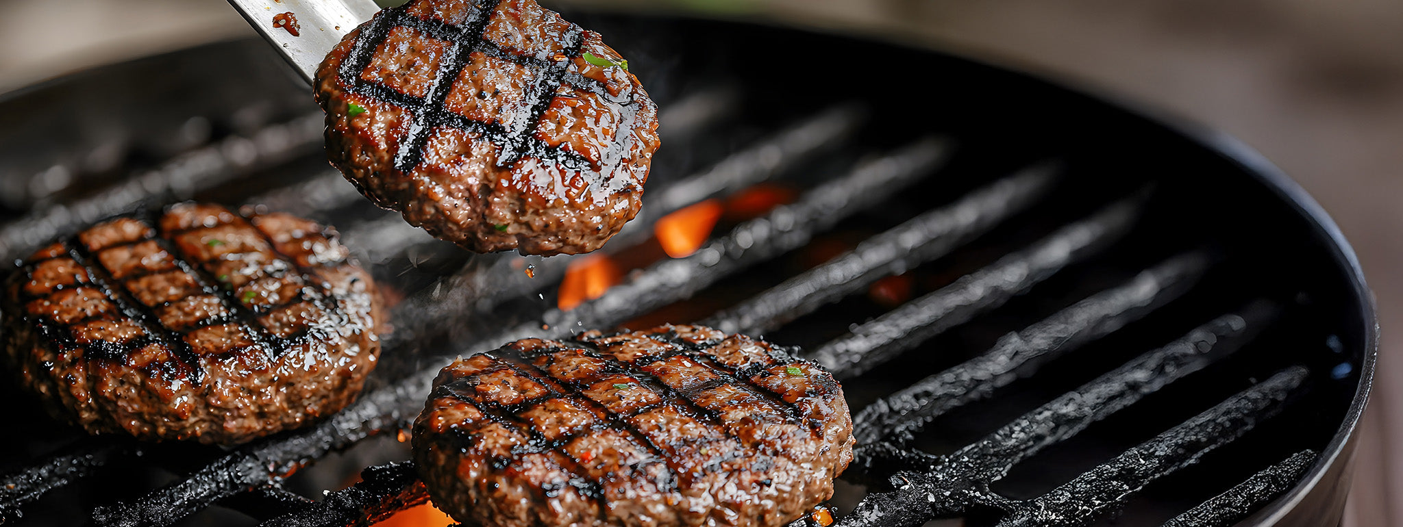 Burgers cooking on a grill